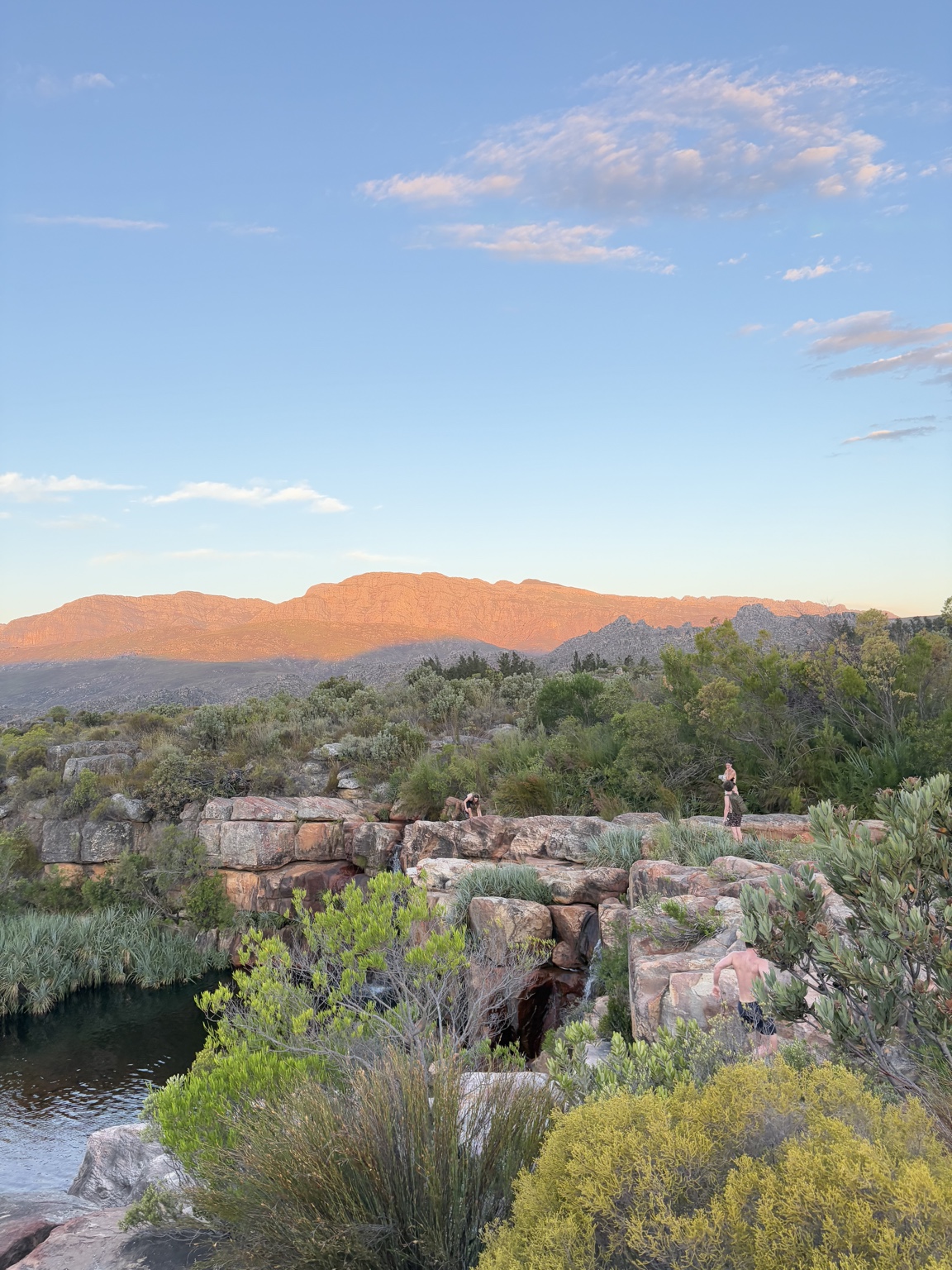 View across the Cederberg mountains and rock pools at sunset