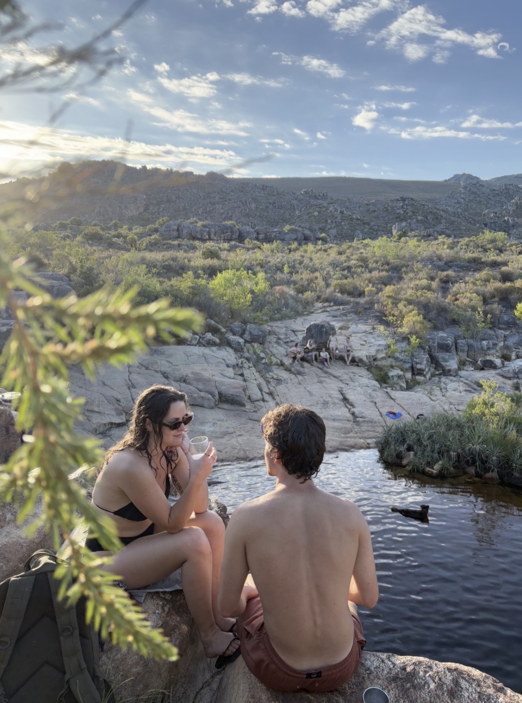 Guests relaxing beside a rock pool